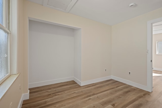 spare room featuring light hardwood / wood-style floors