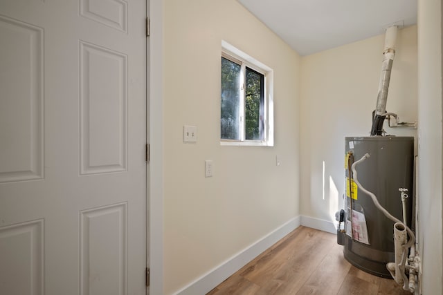 utility room featuring gas water heater