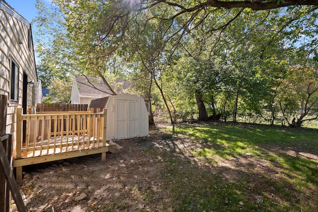 view of yard featuring a shed and a deck