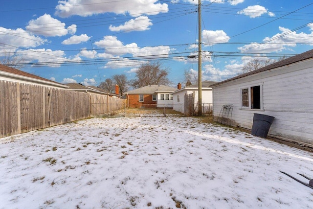 view of yard covered in snow