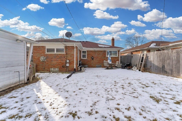 view of snow covered house