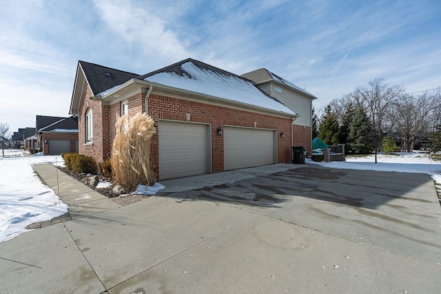 view of side of home featuring a garage