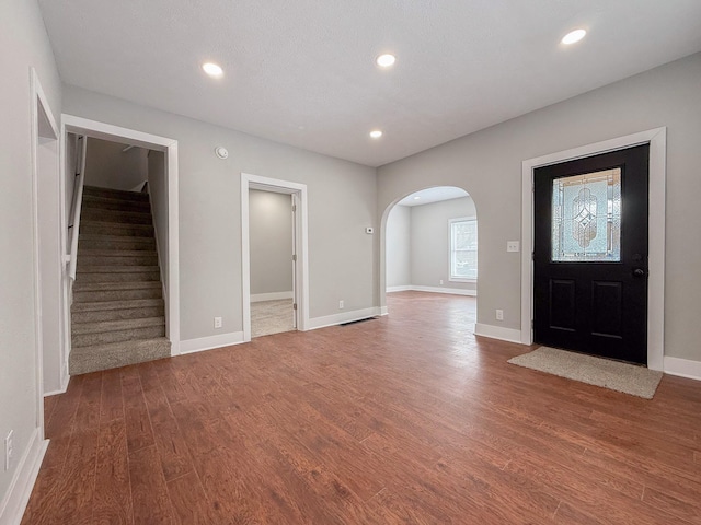 foyer entrance with hardwood / wood-style floors