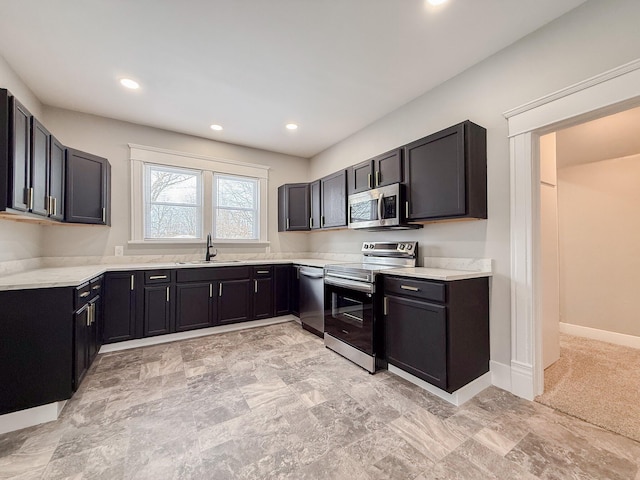 kitchen with sink and appliances with stainless steel finishes