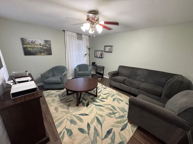 living room featuring ceiling fan and hardwood / wood-style floors