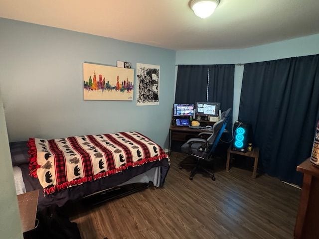 bedroom featuring dark wood-type flooring