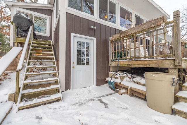 view of snow covered property entrance