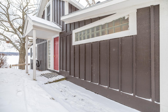 view of snow covered property entrance