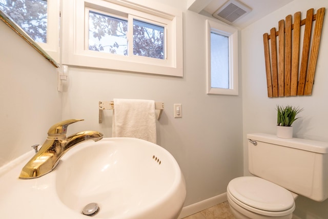 bathroom featuring tile patterned flooring, sink, and toilet