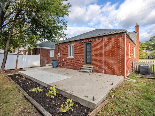 back of house with a patio and central air condition unit