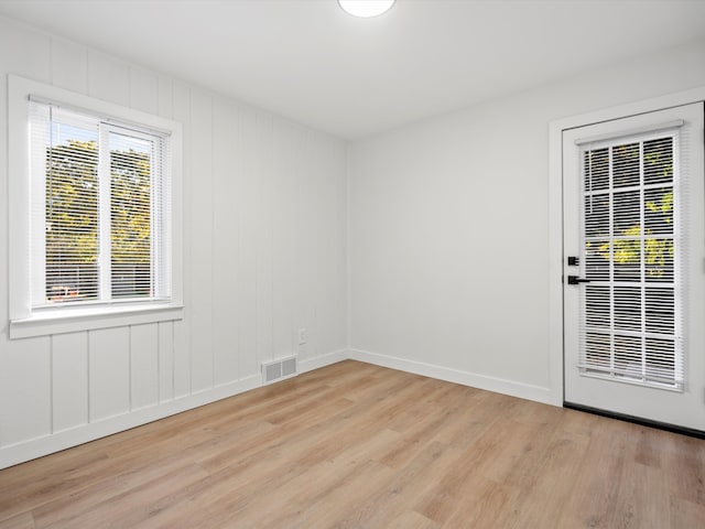 spare room with light wood-type flooring