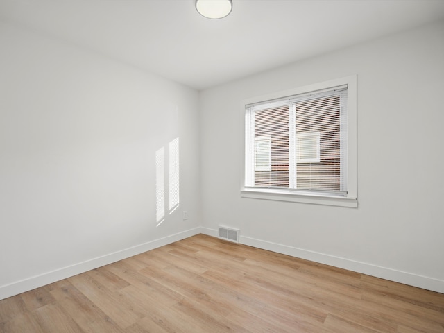 unfurnished room with light hardwood / wood-style floors