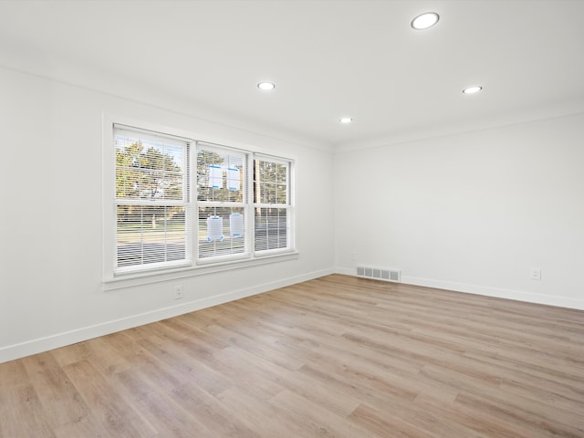 unfurnished room with light hardwood / wood-style flooring