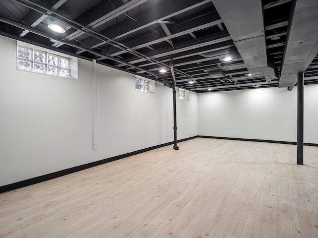 basement featuring light wood-type flooring