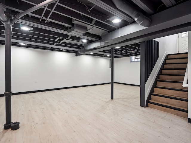 basement with wood-type flooring