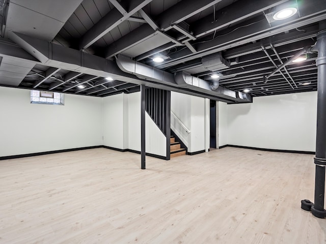 basement featuring hardwood / wood-style floors