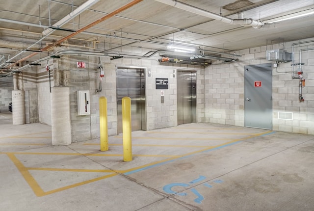 garage with elevator and electric panel