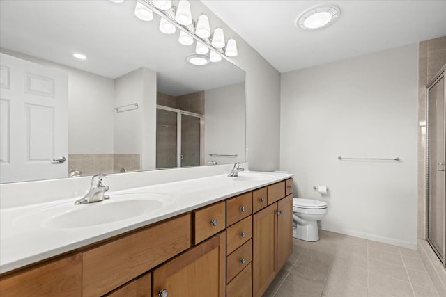 bathroom with vanity, toilet, an enclosed shower, and tile patterned flooring