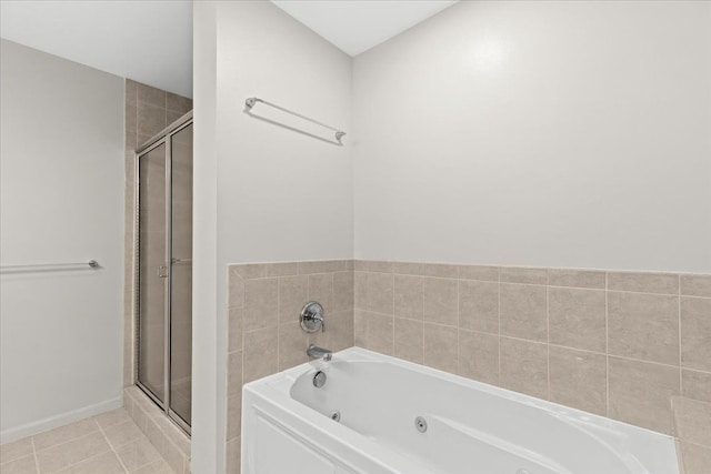 bathroom featuring tile patterned floors and shower with separate bathtub