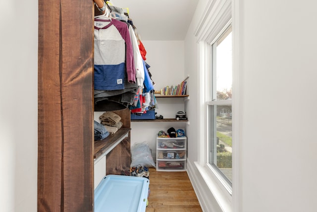 spacious closet featuring light hardwood / wood-style floors