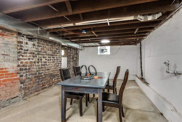 basement with brick wall