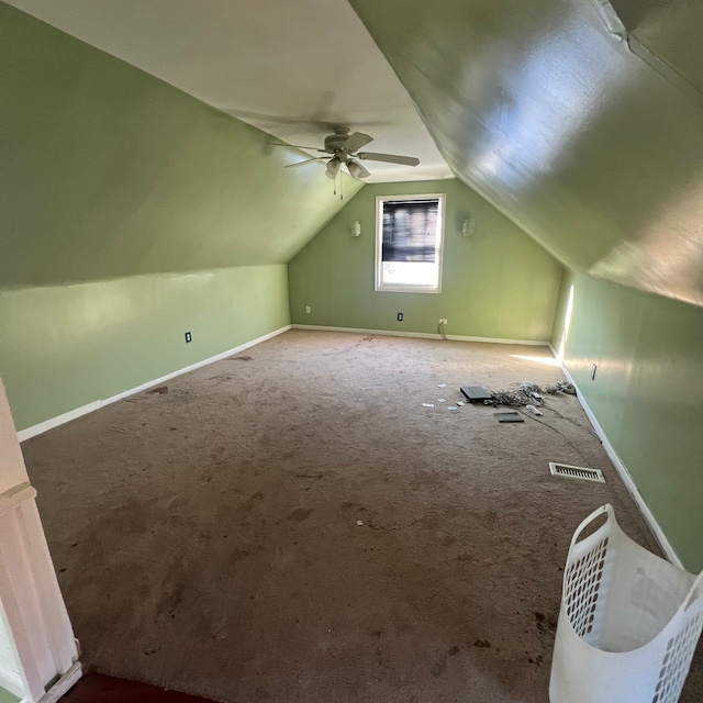 additional living space with lofted ceiling, carpet, and ceiling fan