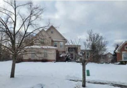 view of yard layered in snow