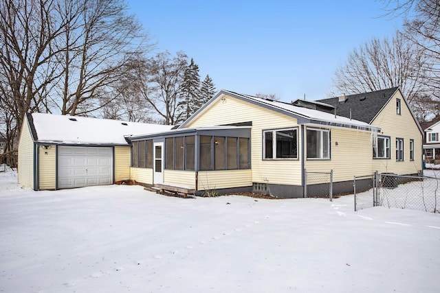 view of front of house with a sunroom