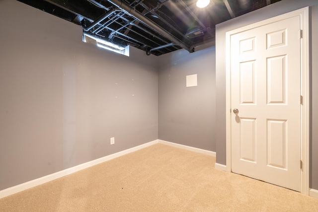 basement with light colored carpet