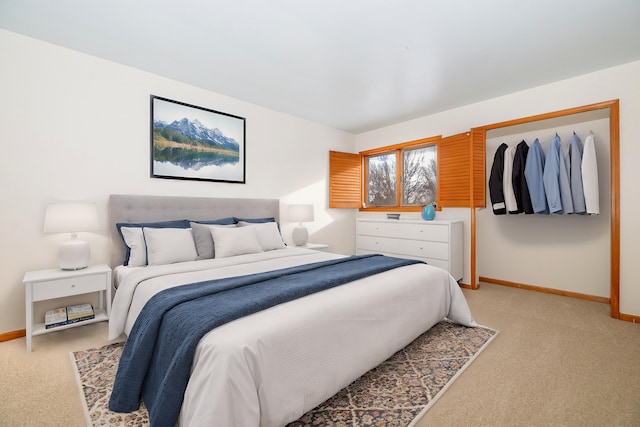 bedroom with light colored carpet