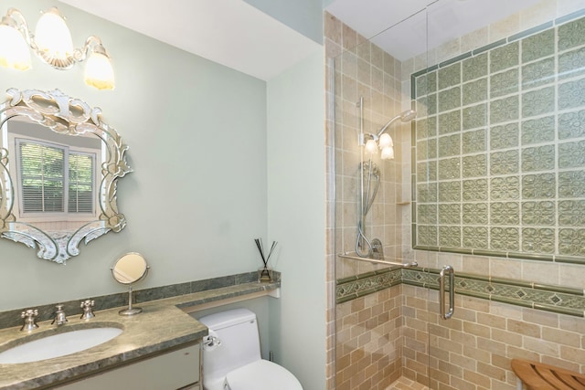 bathroom with walk in shower and vanity