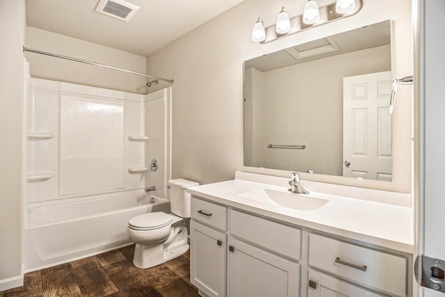 full bathroom featuring vanity, tub / shower combination, hardwood / wood-style floors, and toilet