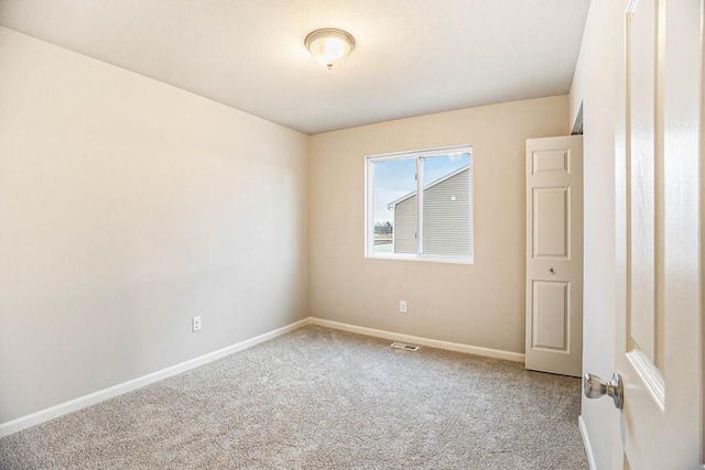 view of carpeted spare room