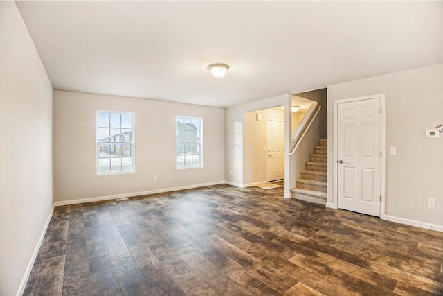 spare room with dark hardwood / wood-style flooring