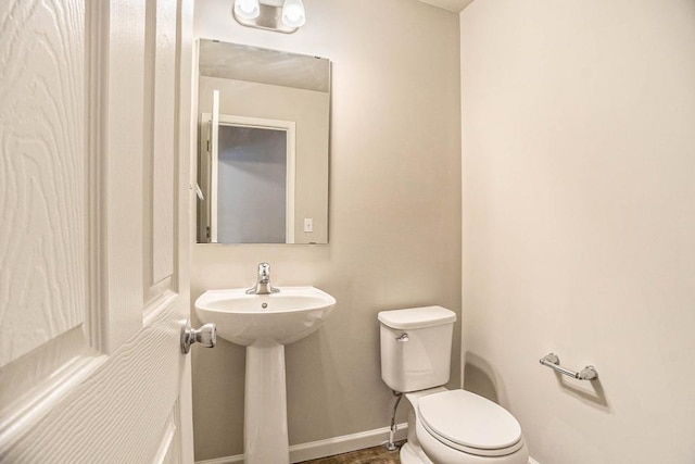 bathroom with toilet and sink