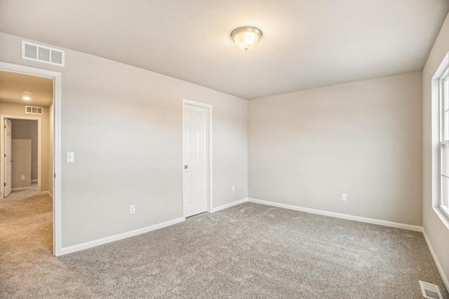 unfurnished room with carpet flooring