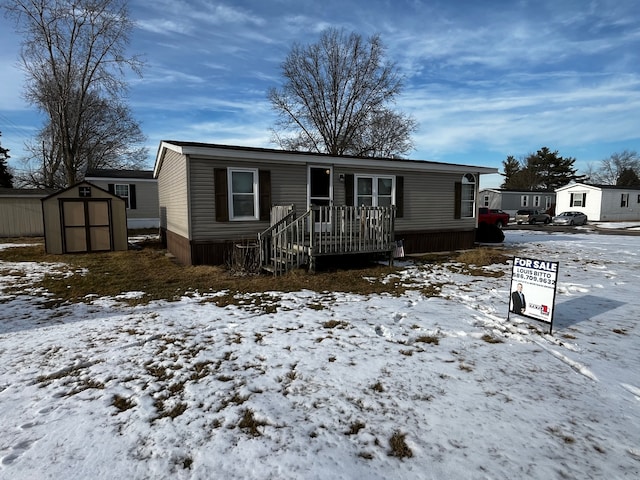 manufactured / mobile home with a storage shed