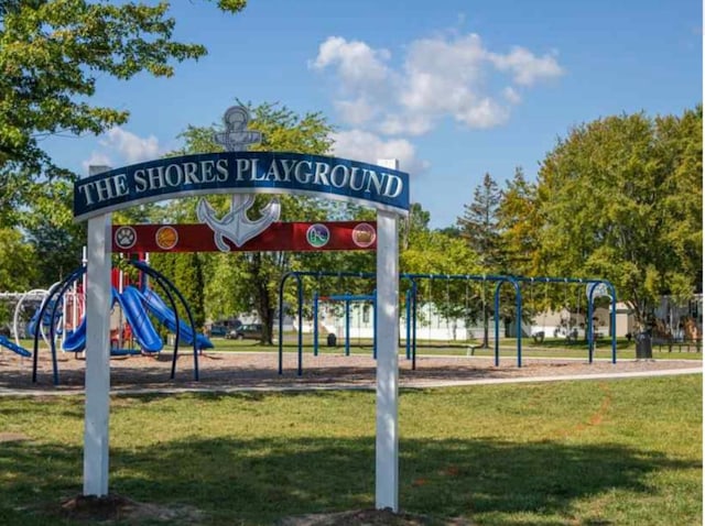 view of home's community featuring a yard and a playground