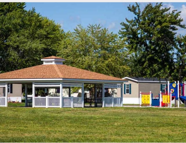 exterior space featuring a lawn and a playground