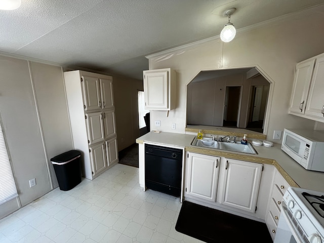 kitchen featuring decorative light fixtures, white cabinetry, sink, white appliances, and a textured ceiling