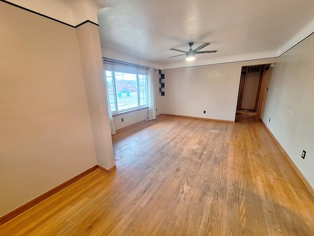 unfurnished room with light hardwood / wood-style floors and ceiling fan