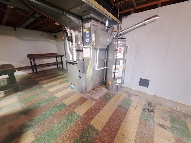 utility room featuring heating unit and water heater