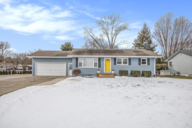 ranch-style home featuring a garage