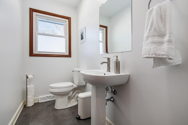 bathroom featuring tile patterned flooring, sink, and toilet