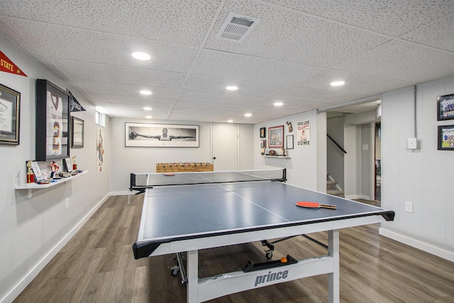 playroom with a drop ceiling and hardwood / wood-style flooring