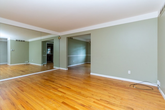 empty room featuring hardwood / wood-style flooring