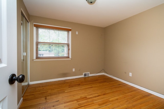 empty room with light hardwood / wood-style floors