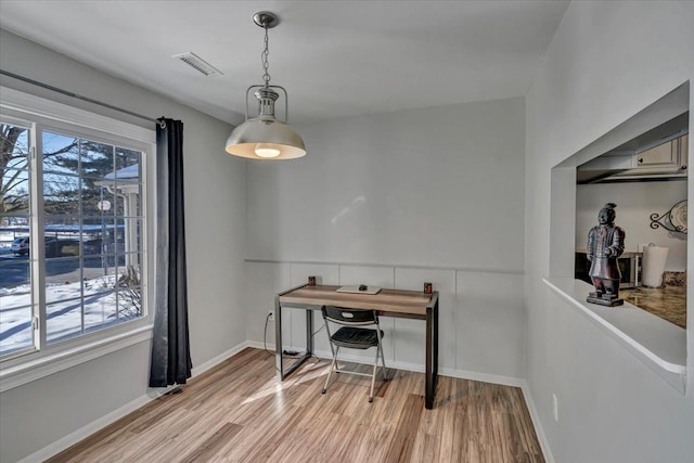 dining area with light wood-type flooring