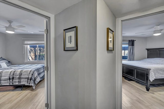 bedroom with ceiling fan and light wood-type flooring