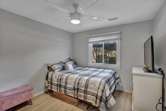 bedroom featuring light hardwood / wood-style floors and ceiling fan